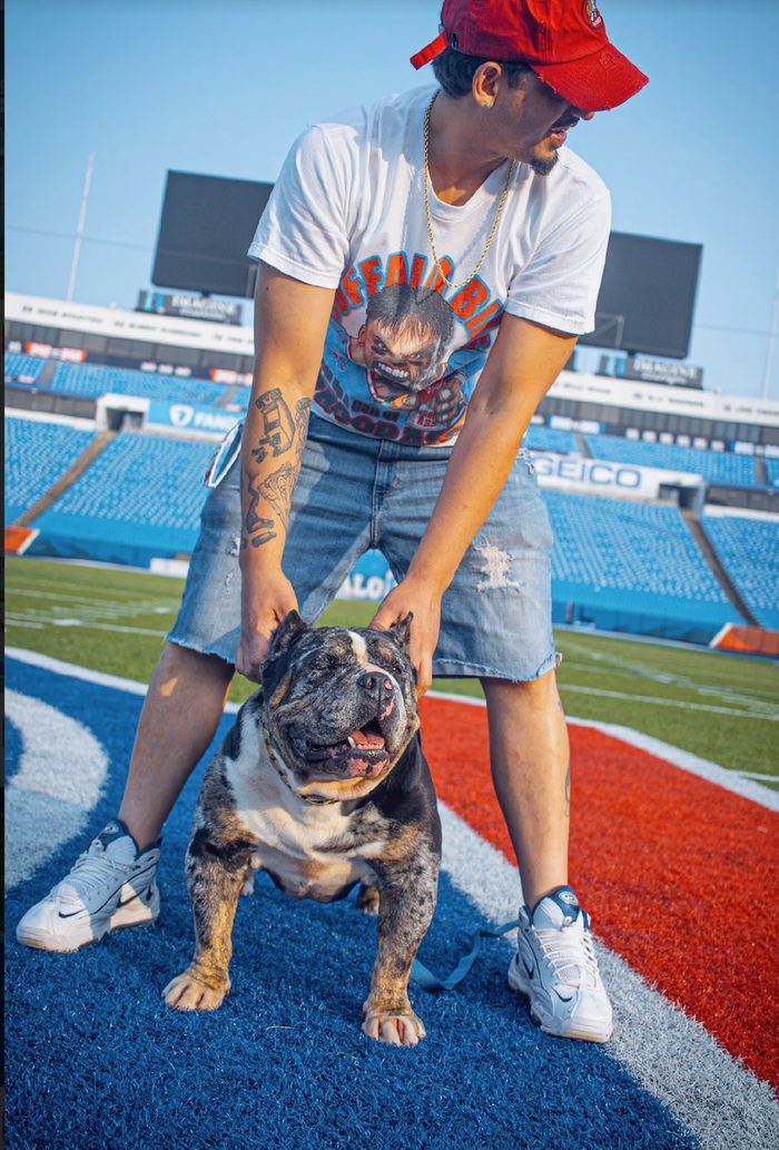 David Singh steadies Famous on the painted end zone turf of an empty Buffalo Bills stadium.